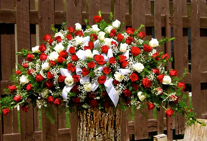 Flower Cottage Cortez sympathy funeral spray red and white roses