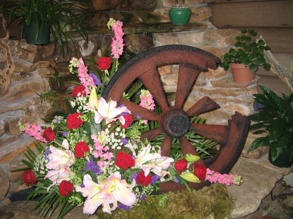 Flower Cottage Cortez sympathy broken wagon wheel custom arrangement